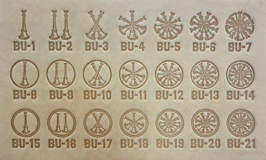 Group of twenty-one Delrin leather stamps showing firefighter bugle rank insignias.