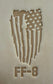 Delrin leather stamp pressing a tattered U.S. flag design with a firefighting axe and Halligan bar into leather.