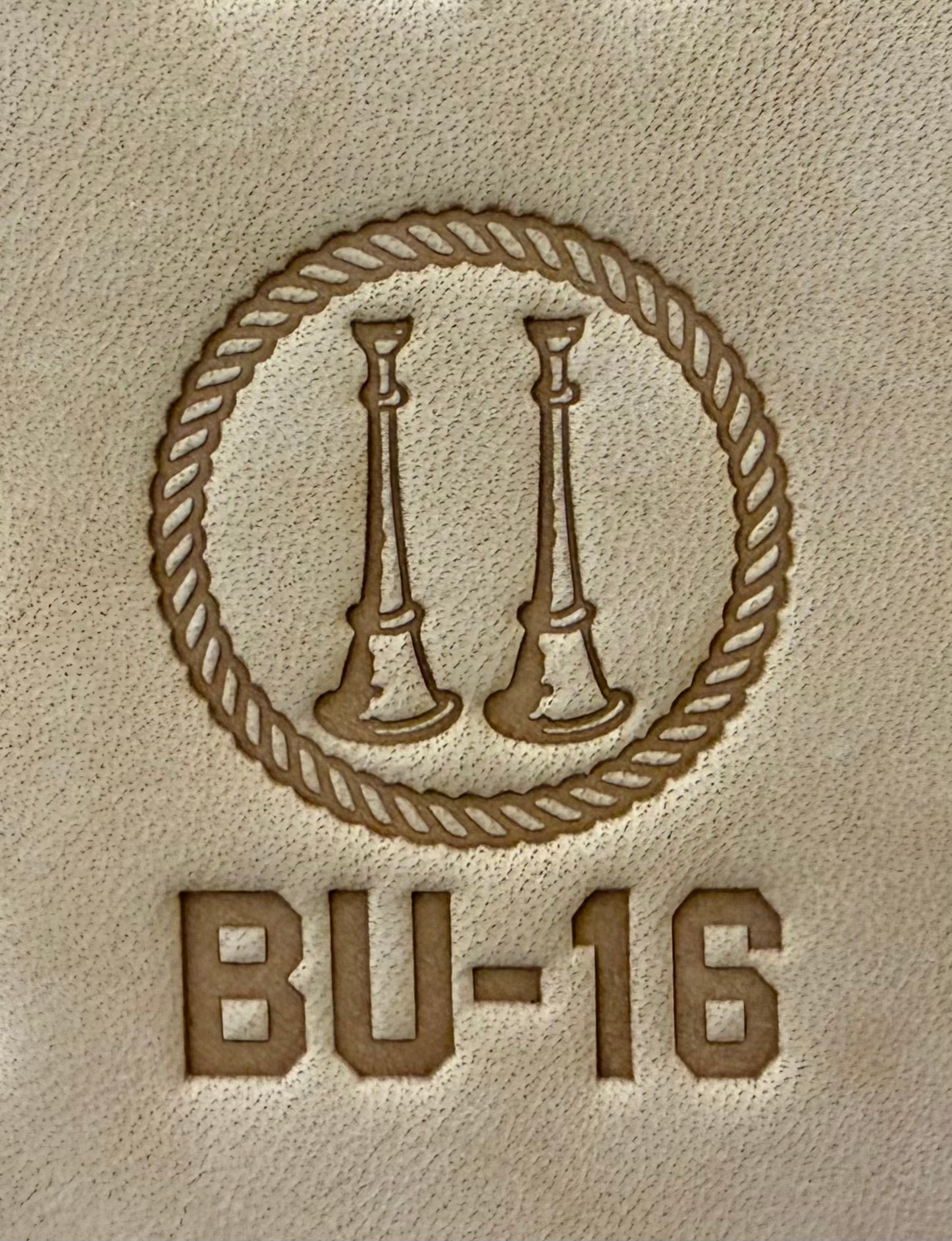 Delrin leather stamp showing firefighter bugle rank insignia.