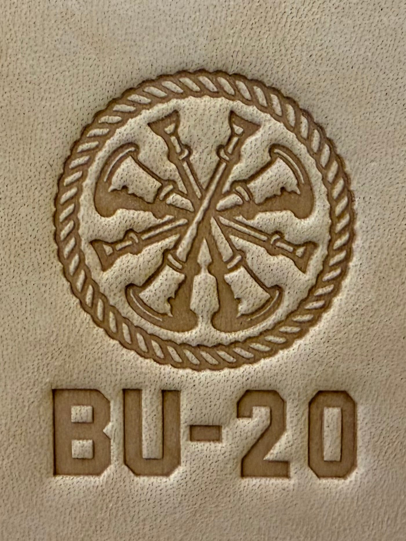 Delrin leather stamp showing firefighter bugle rank insignia.