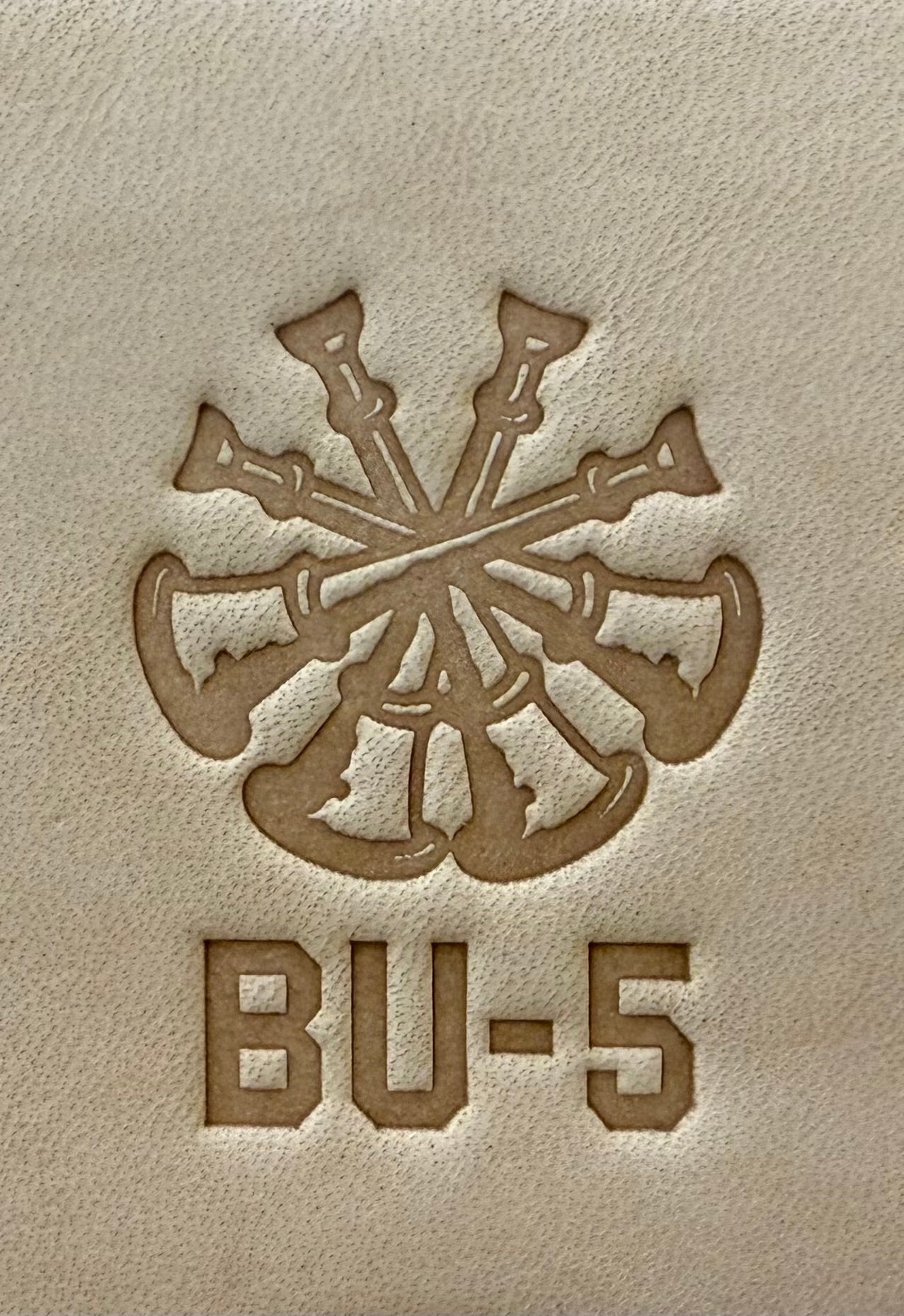 Delrin leather stamp showing firefighter bugle rank insignia.