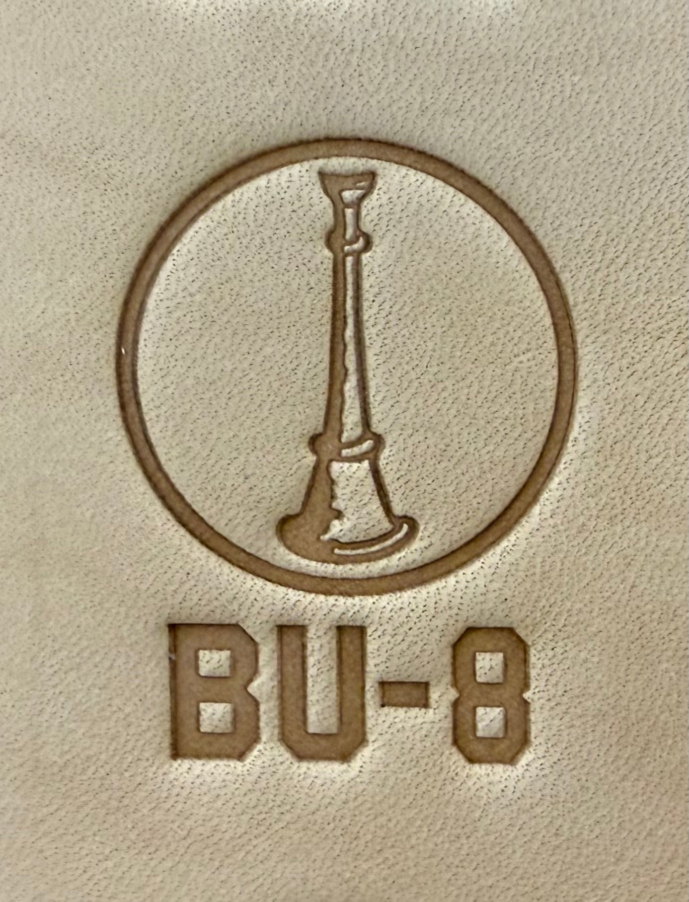 Delrin leather stamp showing firefighter bugle rank insignia.