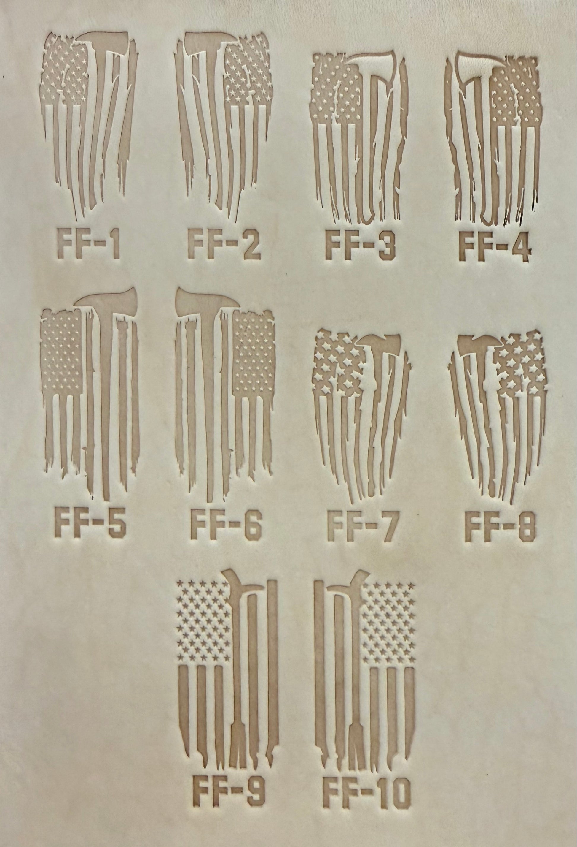Delrin leather stamp pressing a tattered U.S. flag design with a firefighting axe and Halligan bar into leather.