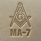 Embossing stamp featuring a Masonic square and compass emblem with the letter G.