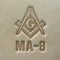 Embossing stamp featuring a Masonic square and compass emblem with the letter G.