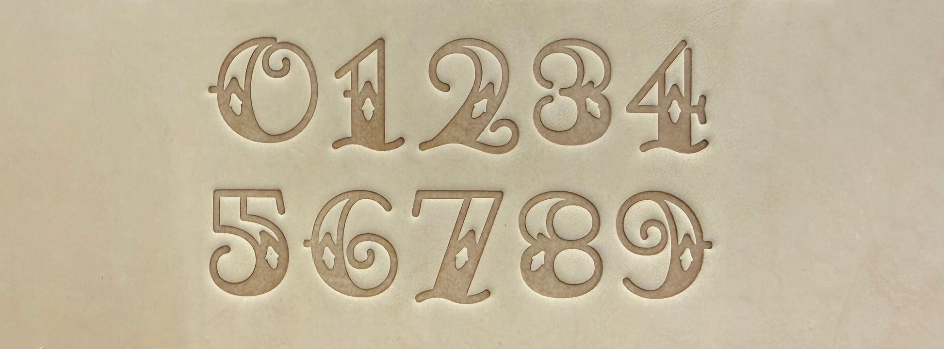 Old school Sailor Jerry tattoo style delrin alphabet letter and number stamp set for leathercrafting.