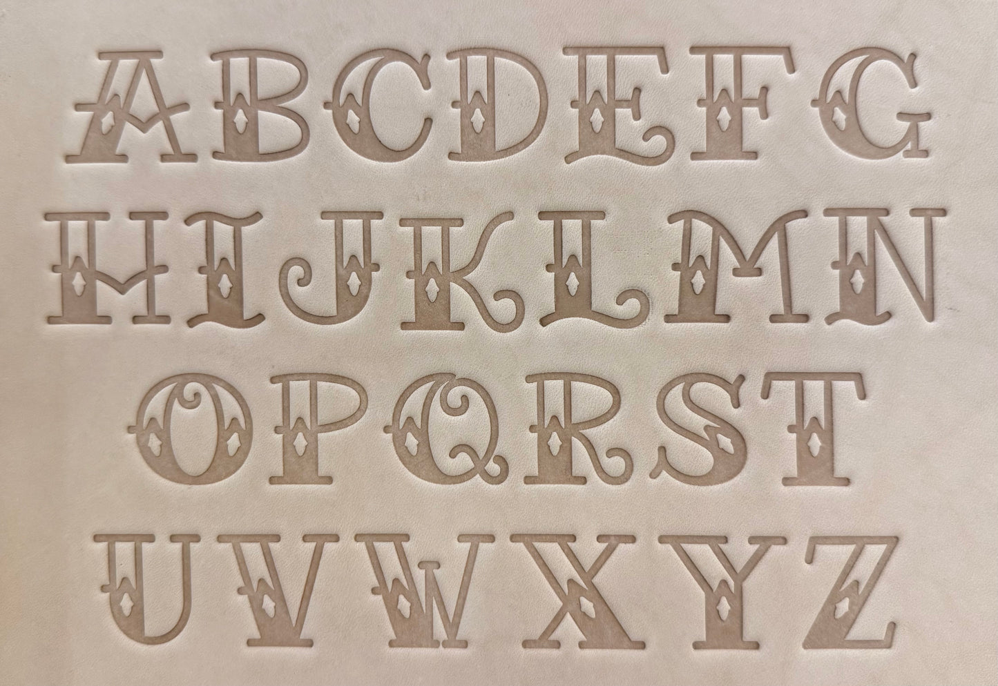 Old school Sailor Jerry tattoo style delrin alphabet letter and number stamp set for leathercrafting.