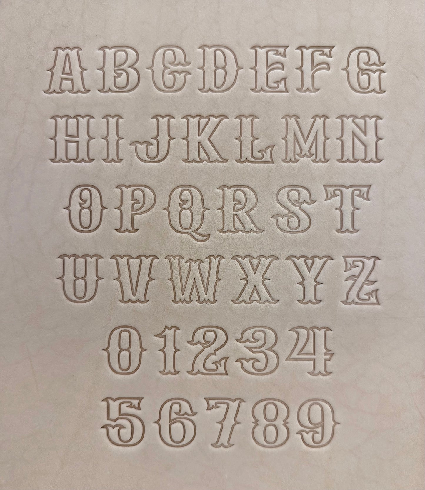 Leathercrafting embossing stamp in western style font.