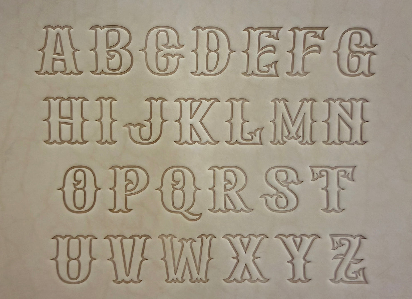Leathercrafting embossing stamp in western style font.