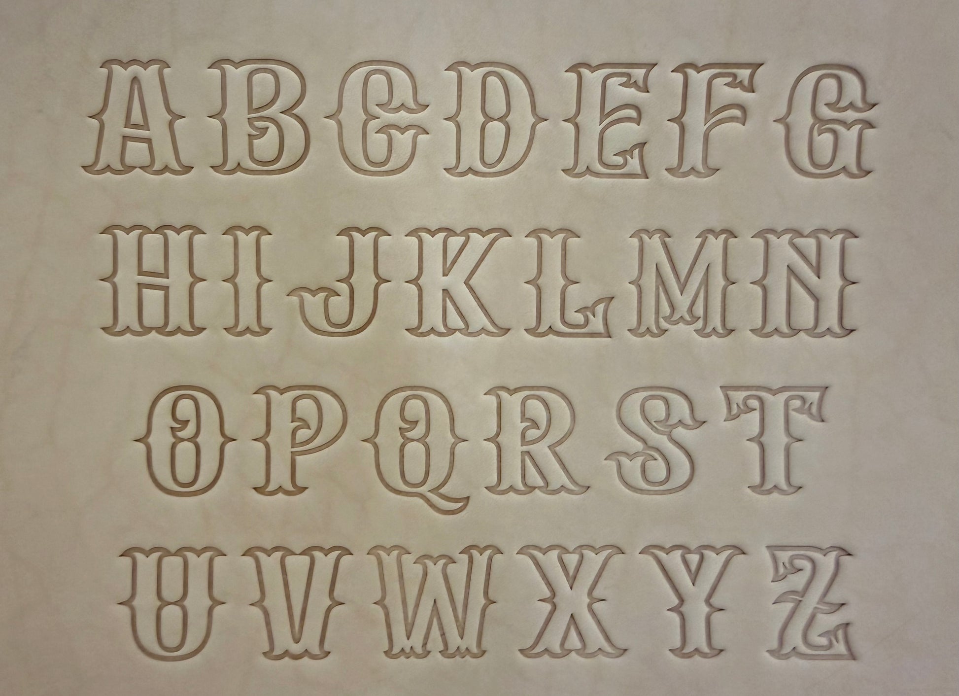Leathercrafting embossing stamp in western style font.